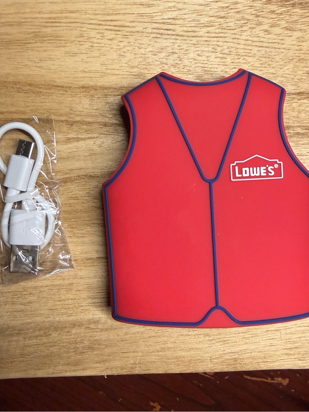 Lowe’s Home Improvement red vest power bank with cord
